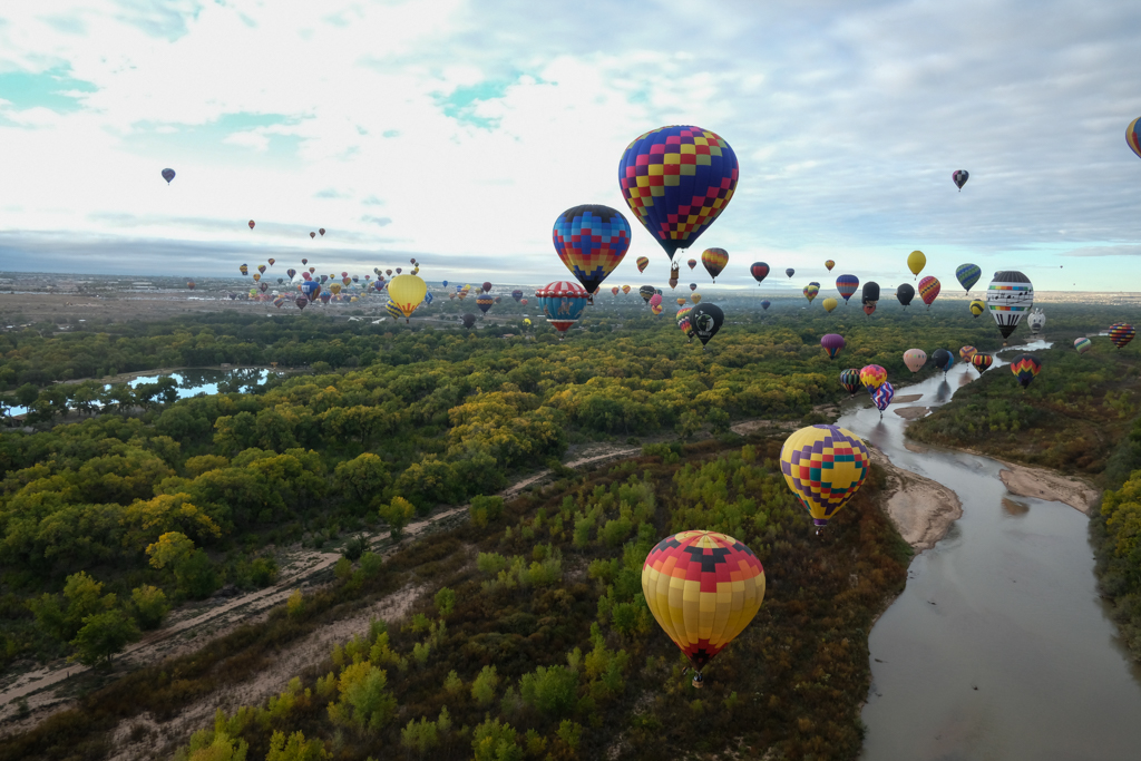 View from a hot air balloon of other balloons