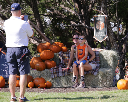 Taking pictures at pumpkin patch