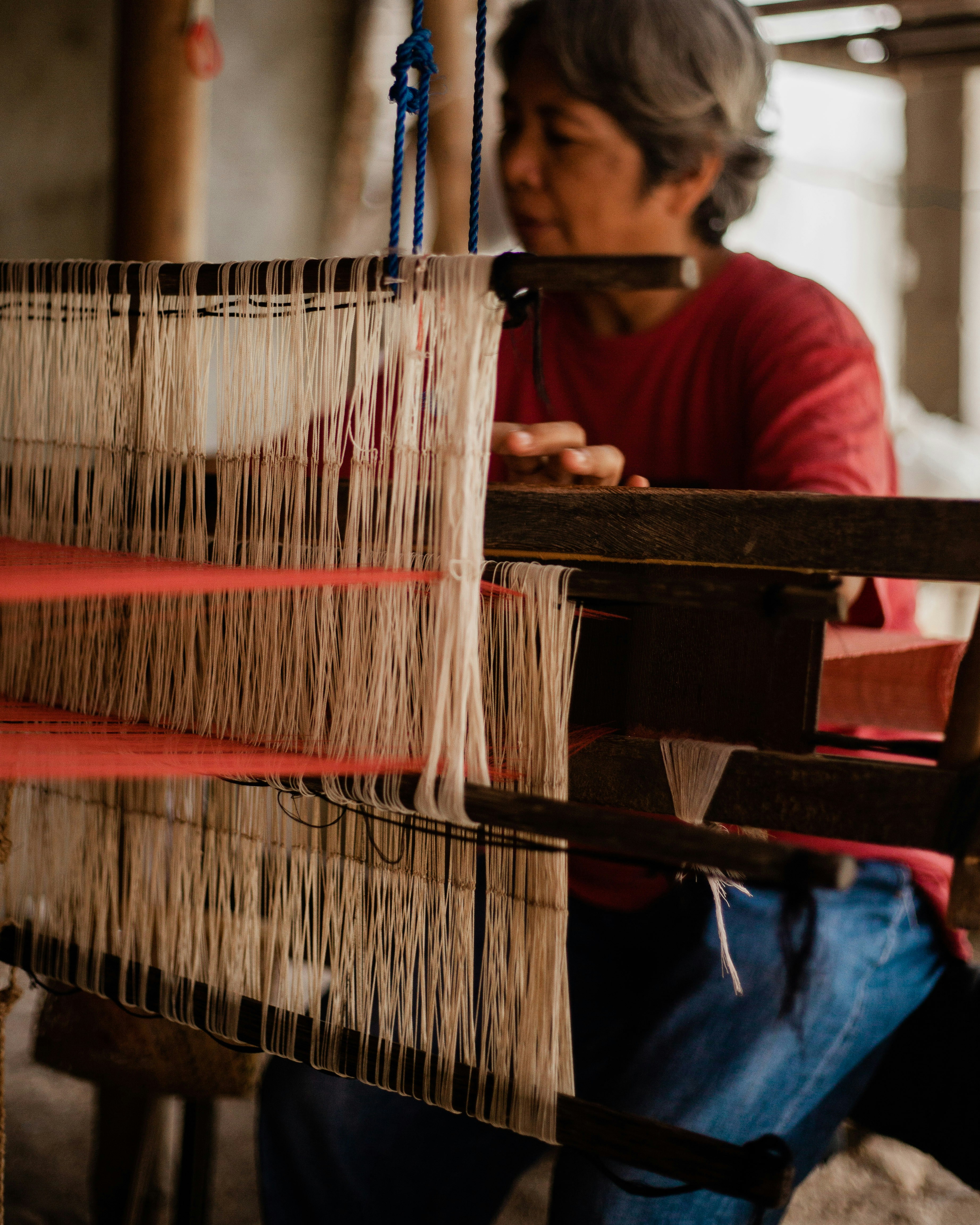a person using a loom