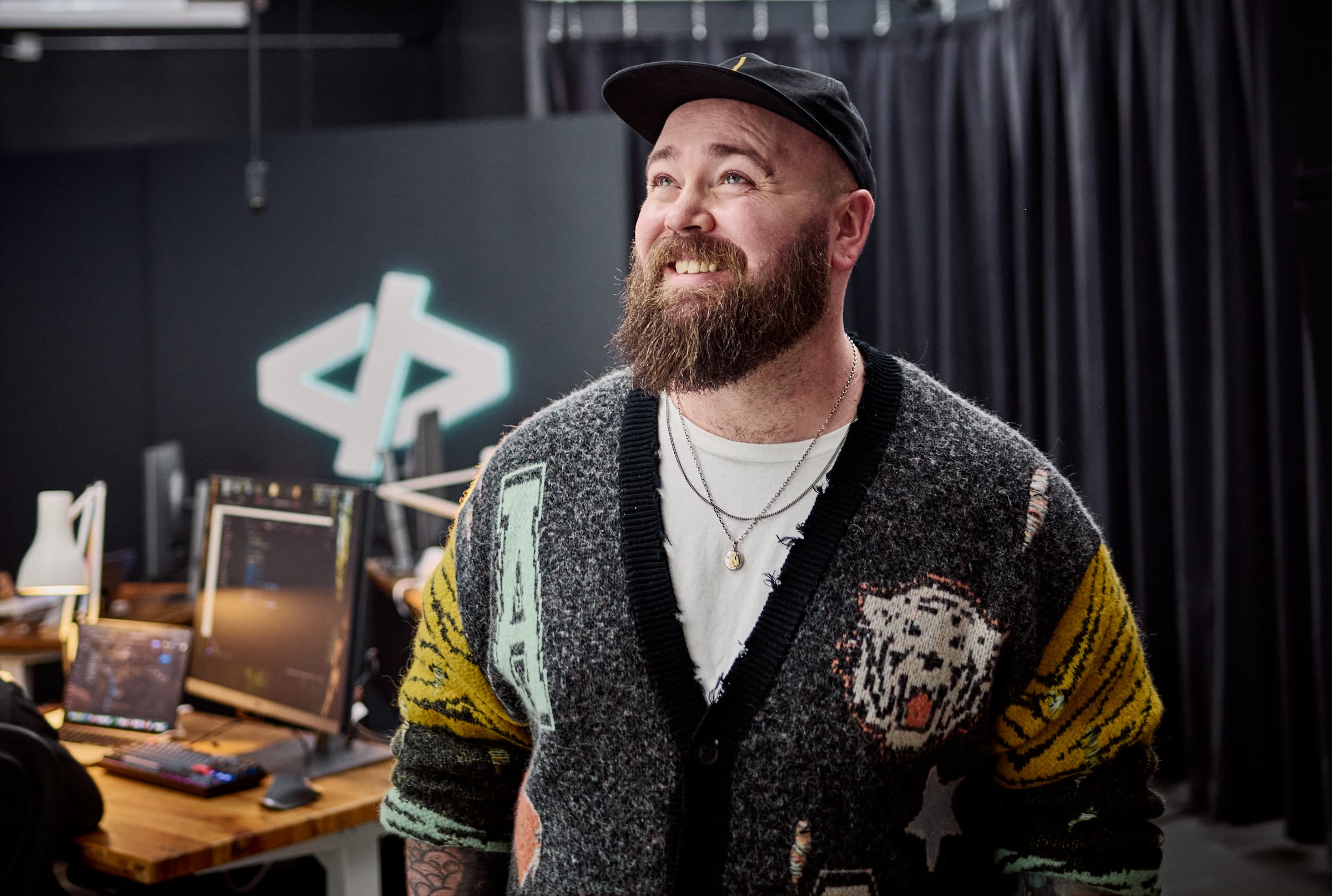 Jason Lengstorf looking up and to his right while smiling in a way that looks like someone caught him off-guard with a good joke