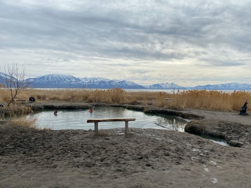 Hot spring with lake in background