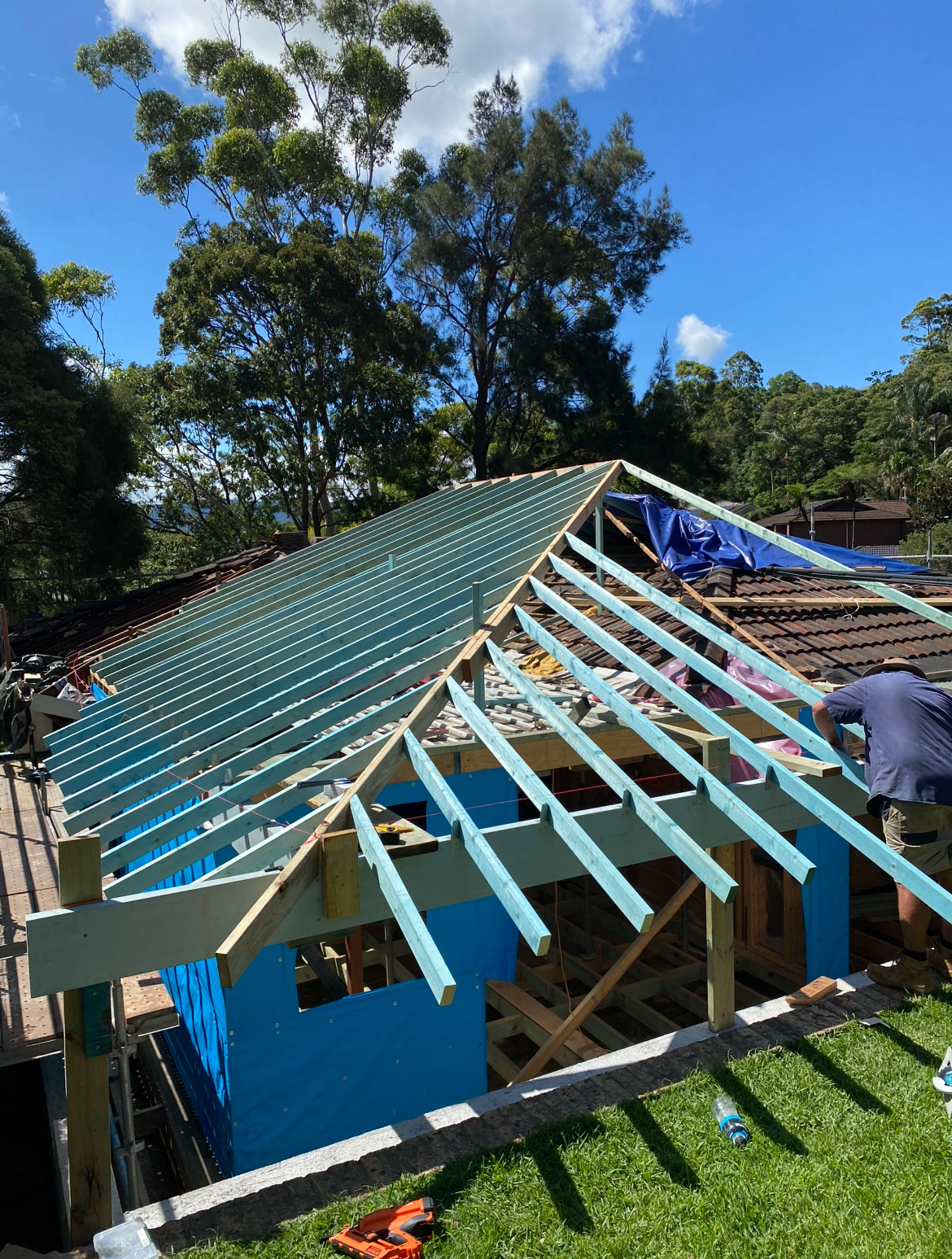 Advanced hip and valley roofing with clean valleys, correct falls, and compliant tie-downs