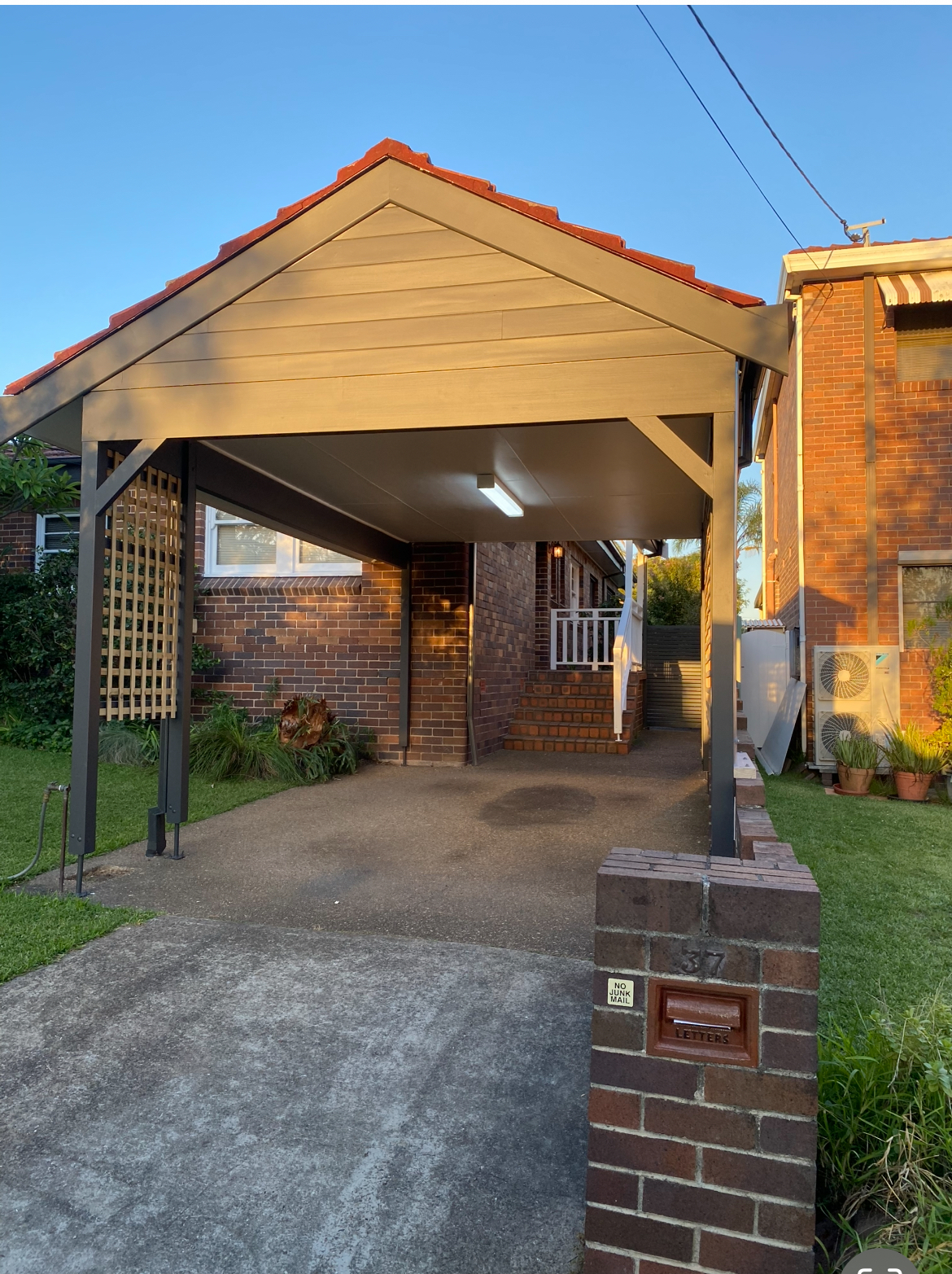 Architectural pergola and back deck with integrated lighting and weather-friendly detailing