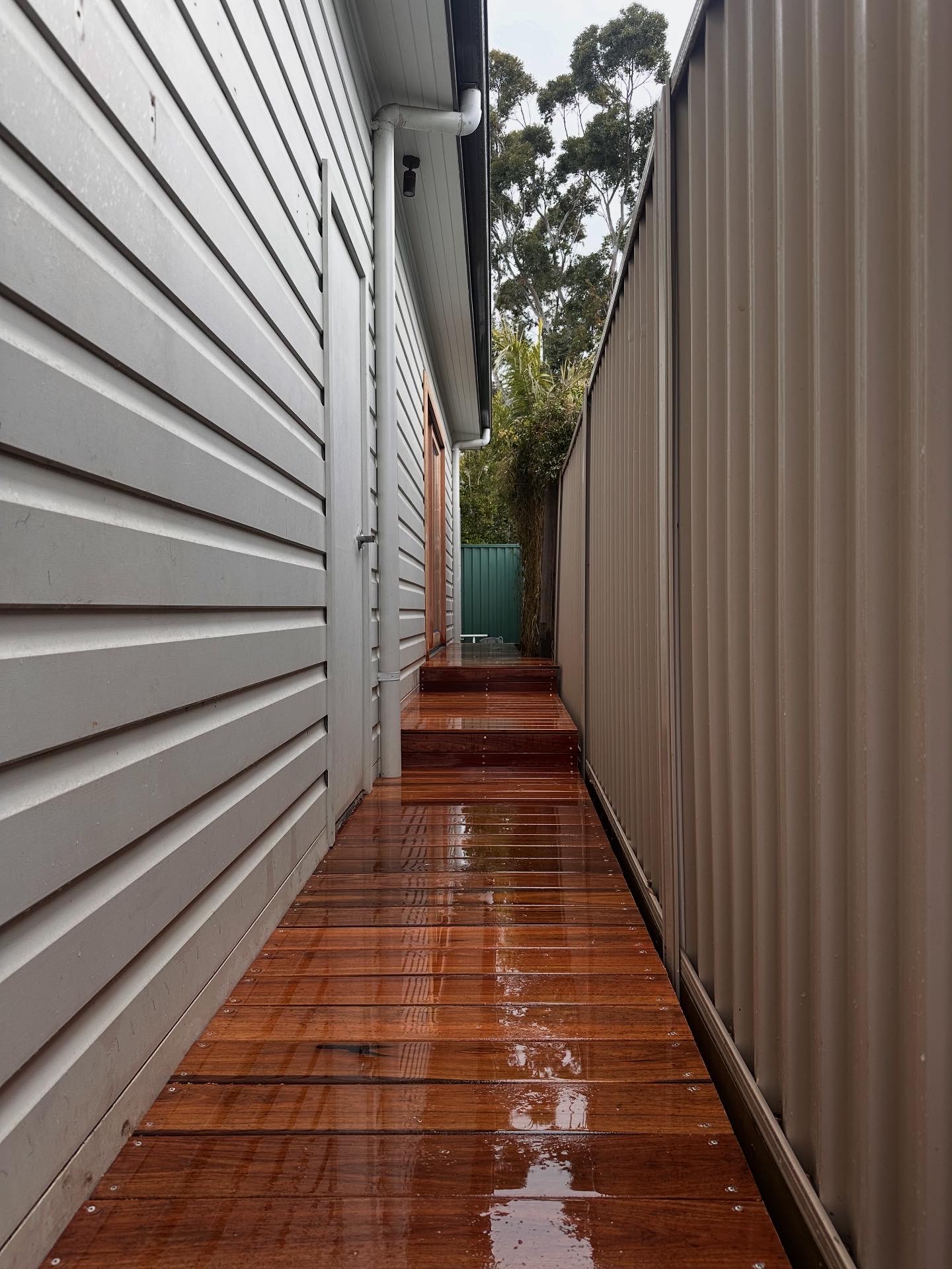 Premium hardwood/composite deck engineered for Sydney's climate, with concealed fixings and long-life finish